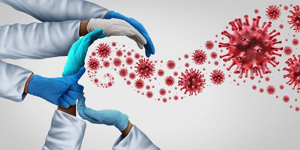 Foto de Bactérias e luva médica